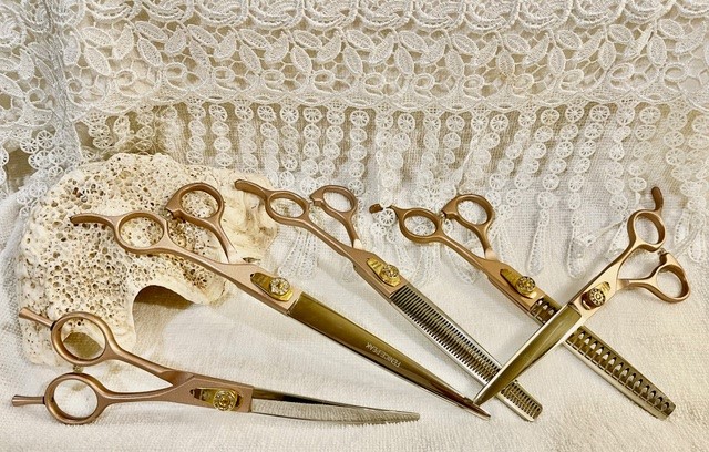 Five golden scissors